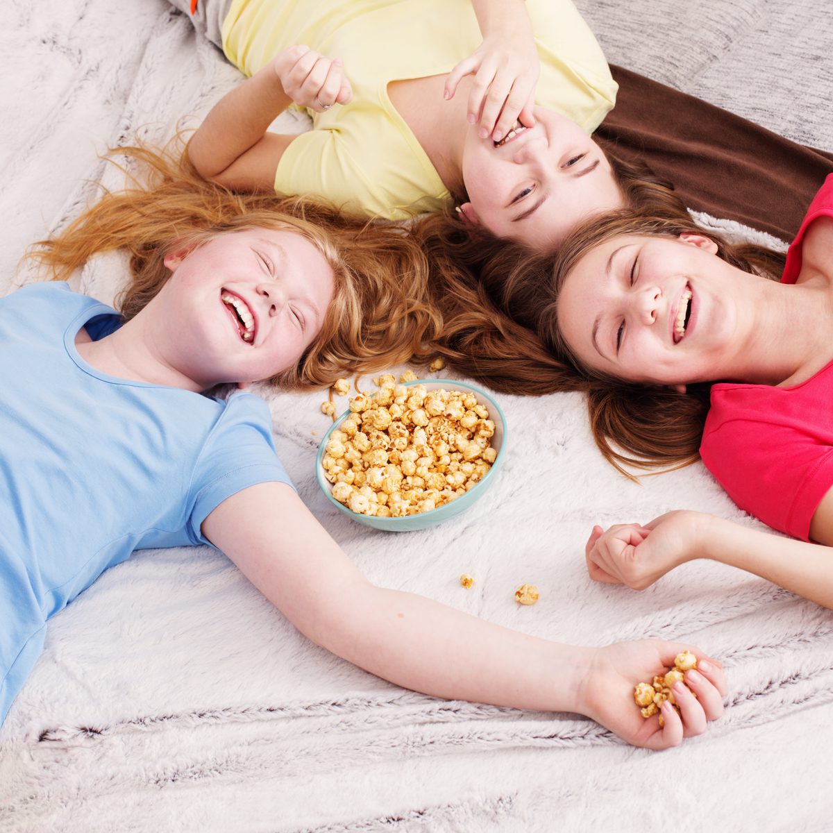 kids playing on a bed